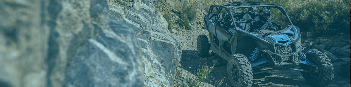 Can-am coming around a boulder